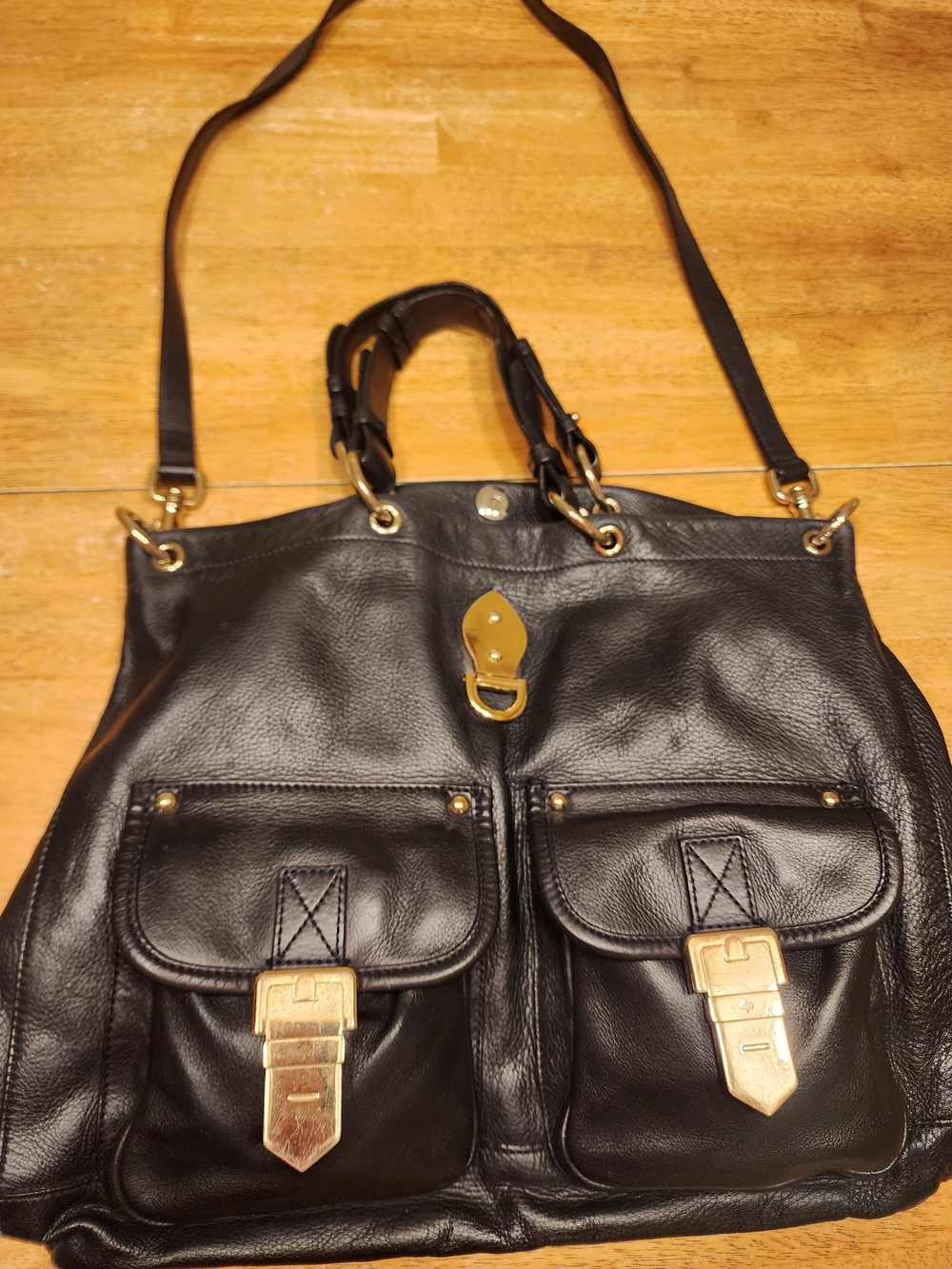 black leather Mulberry Tillie Tote featuring distinctive gold-tone hardware